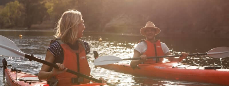 man and woman kayaking