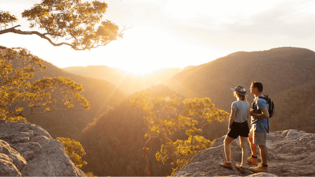 couple hiking at sunset