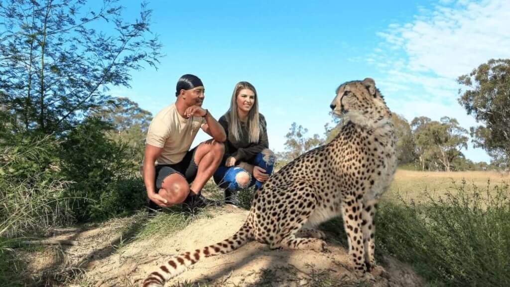 couple-with-wild-cat-at-conservation-centre