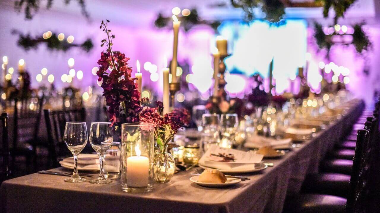 Wedding tables decorated with white and crystal tableware