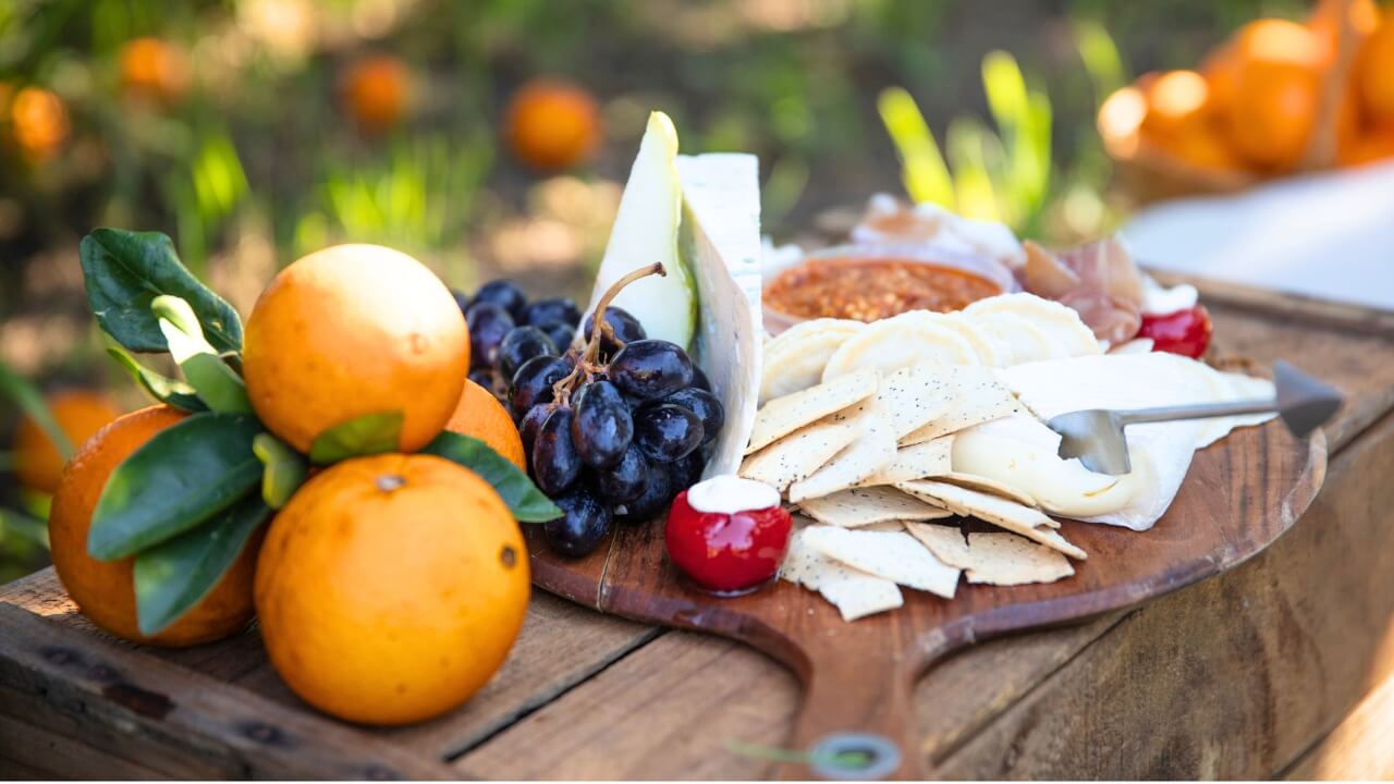 Fruit and nut platter served on wooden paddle